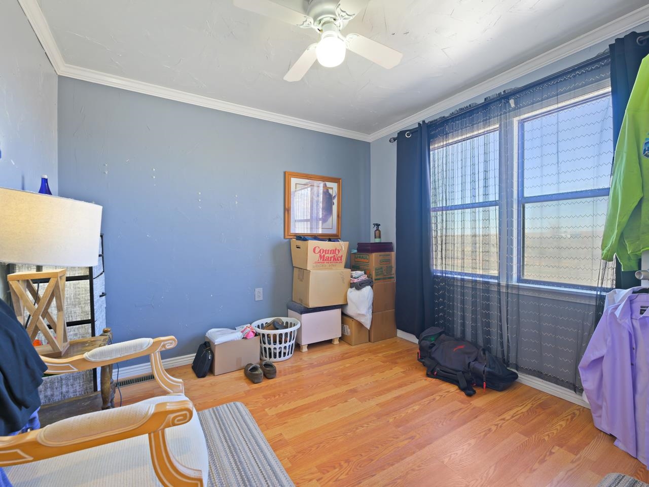 6777 Reeder Mesa Road Whitewater, CO 81527 - Photo 17 of 42 a bedroom with a bed and wooden floor