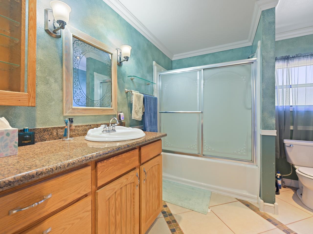 6777 Reeder Mesa Road Whitewater, CO 81527 - Photo 18 of 42 a bathroom with a granite countertop sink and a mirror