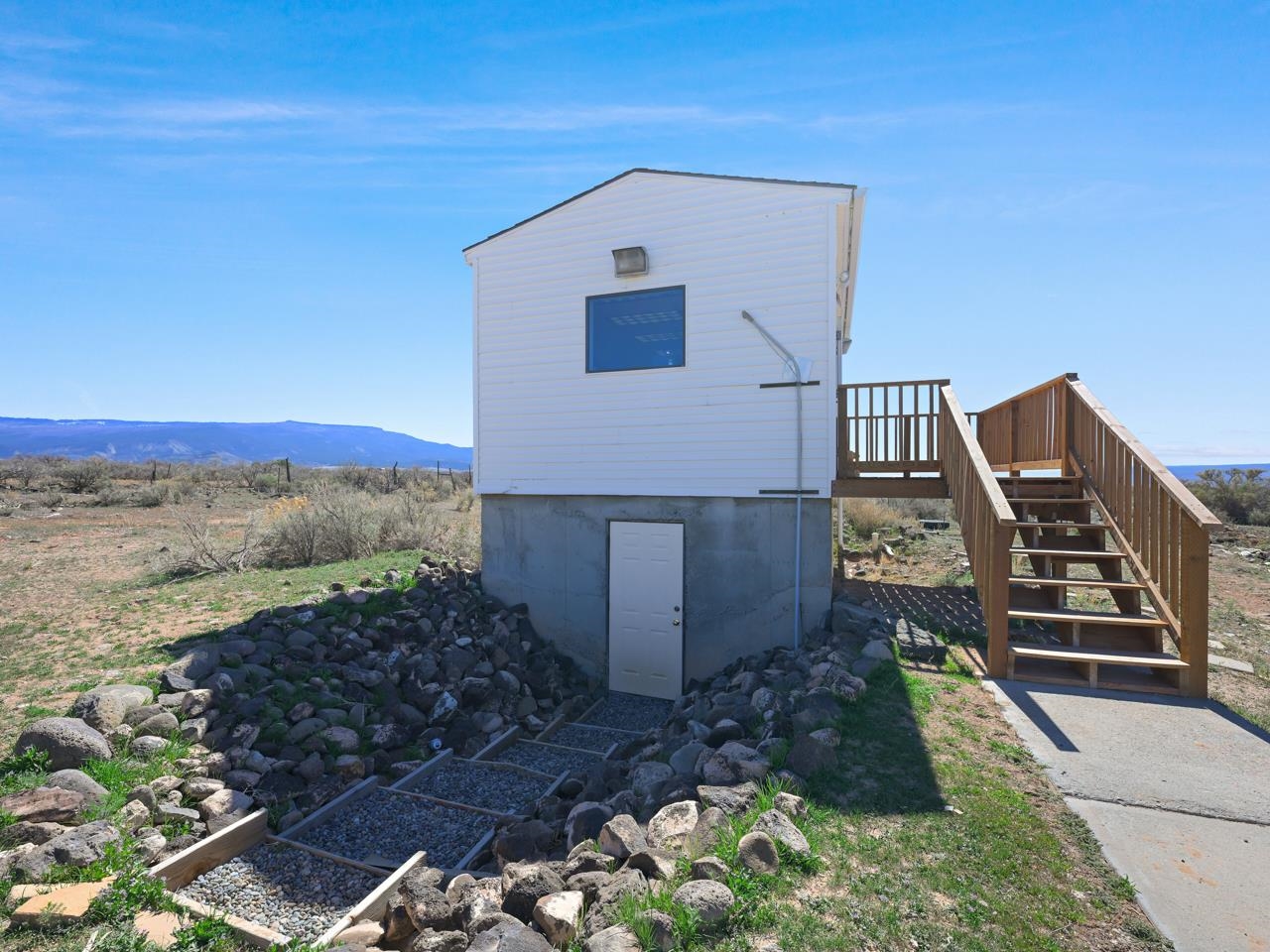 6777 Reeder Mesa Road Whitewater, CO 81527 - Photo 28 of 42 a front view of a house with a yard