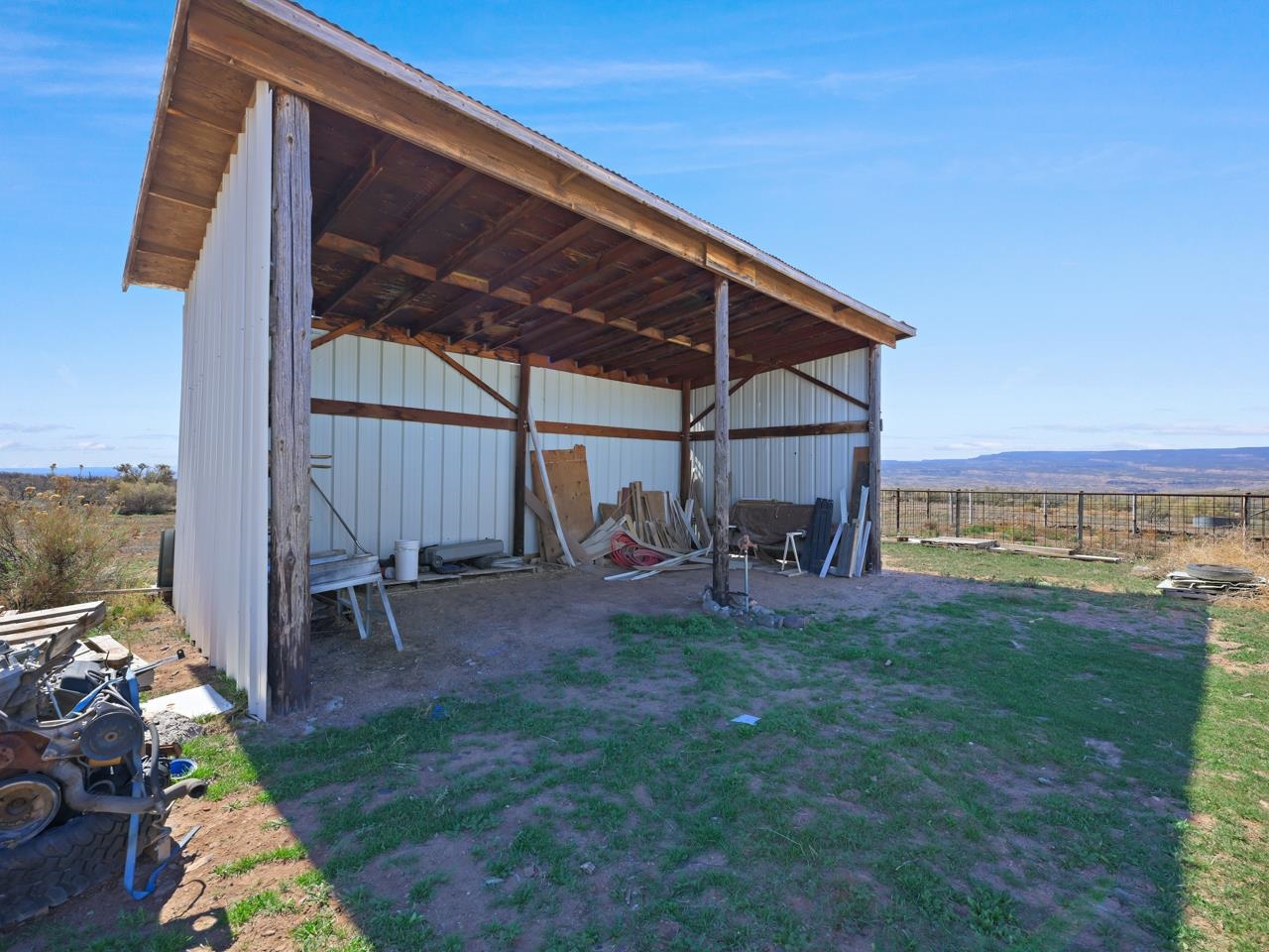 6777 Reeder Mesa Road Whitewater, CO 81527 - Photo 30 of 42 a view of a backyard with hardwood area and sitting area