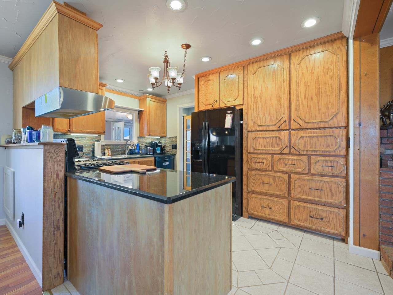 6777 Reeder Mesa Road Whitewater, CO 81527 - Photo 8 of 42 a kitchen with stainless steel appliances granite countertop a refrigerator a sink and a stove