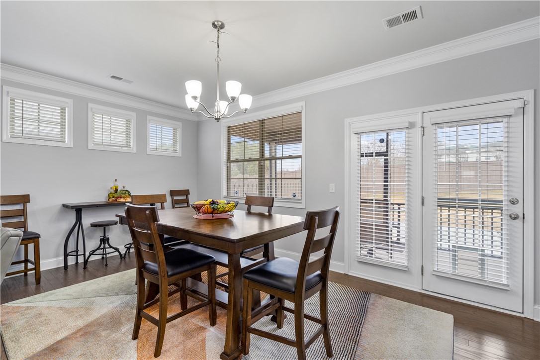 120 Rossmoor Court Anderson, SC 29621 - Photo 13 of 32 This dining area features elegant crown molding and rich hardwood flooring, perfect for memorable gatherings.