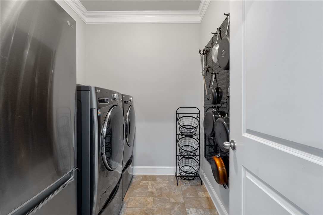 120 Rossmoor Court Anderson, SC 29621 - Photo 25 of 32 This dedicated utility room offers convenient laundry solutions with additional storage.