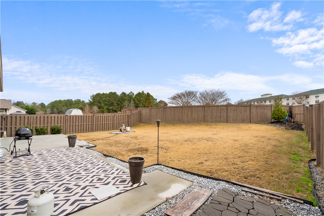120 Rossmoor Court Anderson, SC 29621 - Photo 30 of 32 This spacious yard offers a blank canvas for outdoor enjoyment and future landscaping dreams.