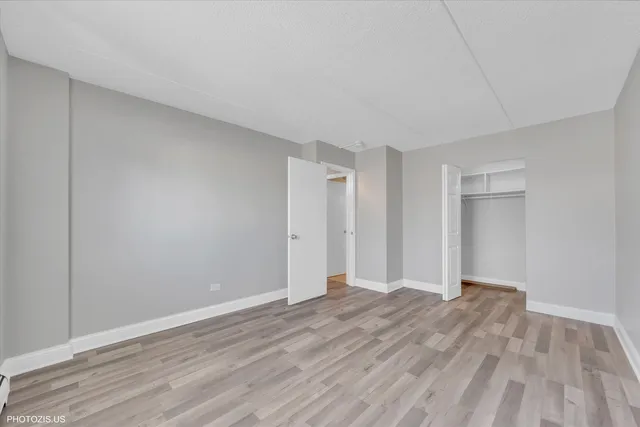 a view of room with wooden floor