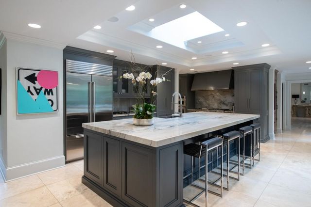 a dining room with furniture a chandelier and a rug