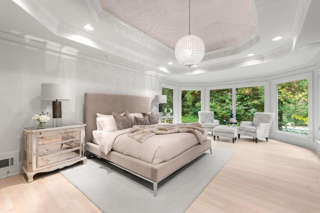 a dining room with furniture and kitchen view