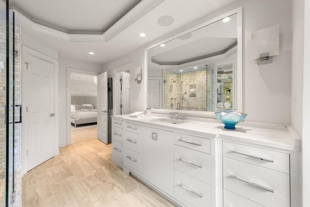 a view of a patio with table and chairs under an umbrella