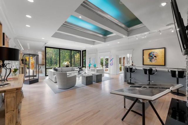 a living room with fireplace furniture and a flat screen tv