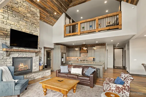 a view of a balcony with wooden floor and fence