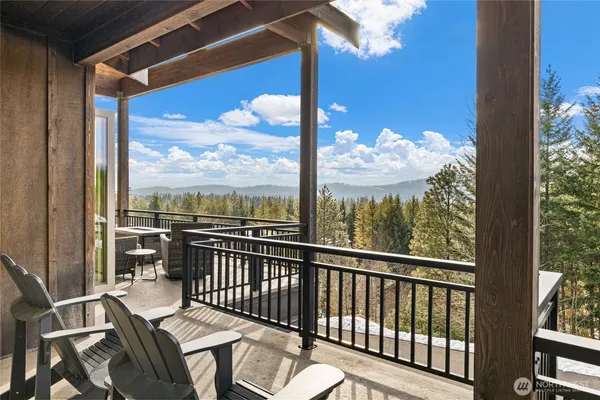 a bedroom with a bed a couch and a window