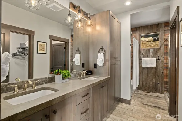 a bathroom with a sink toilet and shower