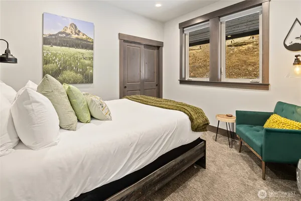 a bedroom with a bed and window