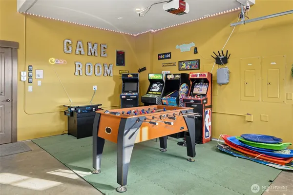 a bathroom with a sink mirror and shower
