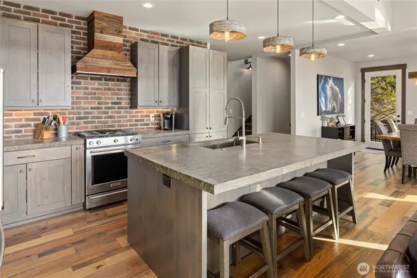 a living room with furniture city view and large windows