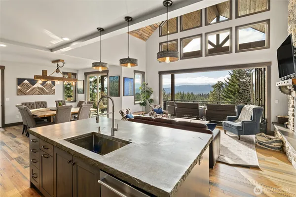 a view of a patio with couches table and chairs and potted plants