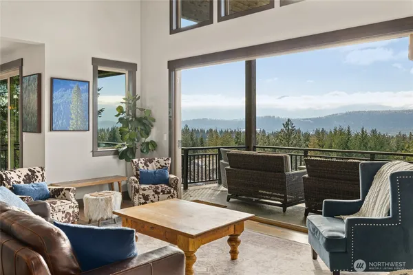 a view of a city from a balcony with seating space