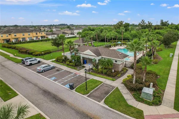an aerial view of residential houses with outdoor space and river