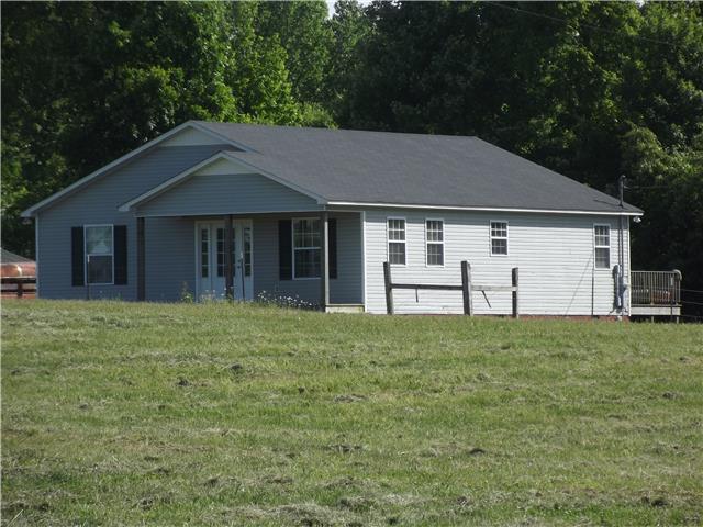 3681 Fall River Road Pulaski, TN 38478 - Photo 1 of 14 a house with trees in the background