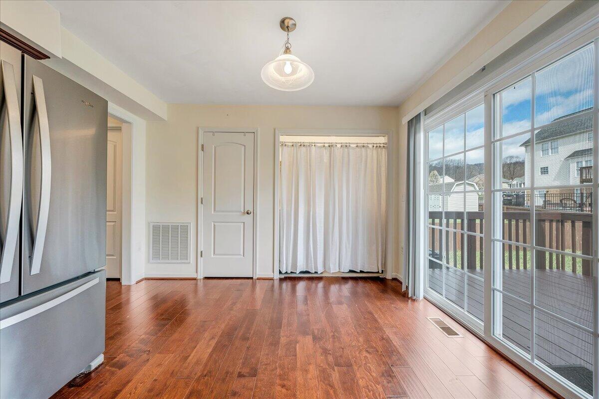 427 Cambridge Ct Road Vinton, VA 24179 - Photo 19 of 46 a view of a livingroom with wooden floor and staircase