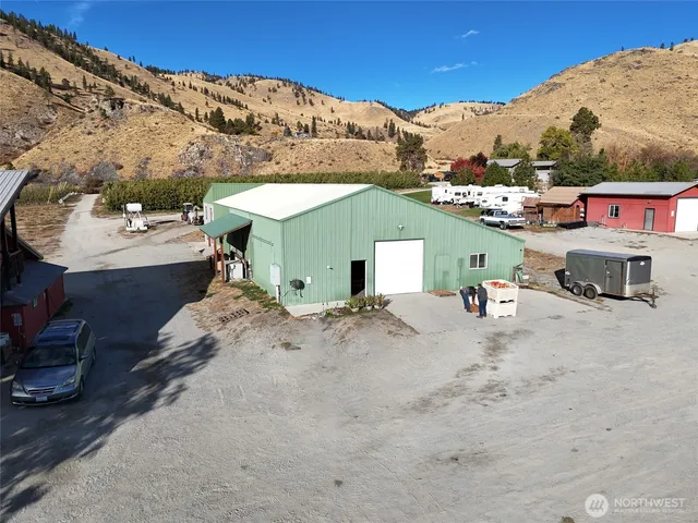 a white car parked in front of a building