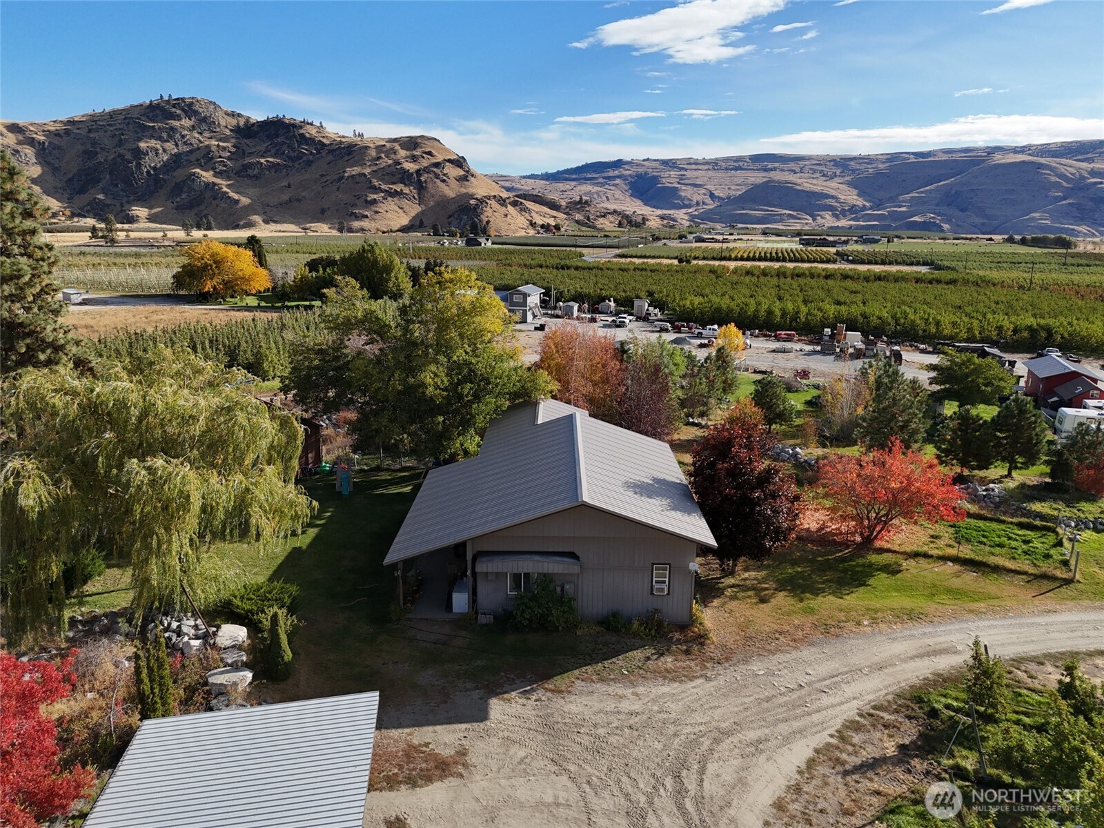 263 Oliver Lane Chelan, WA 98816 - Photo 20 of 39 an aerial view of a house with a garden and lake view