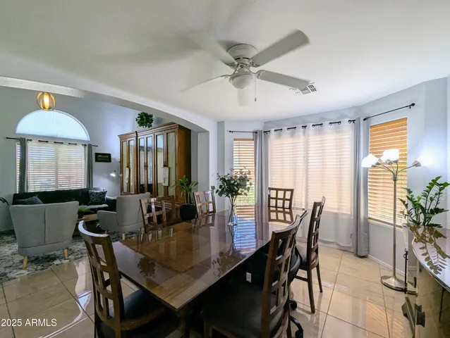 a view of a dining room with furniture and window