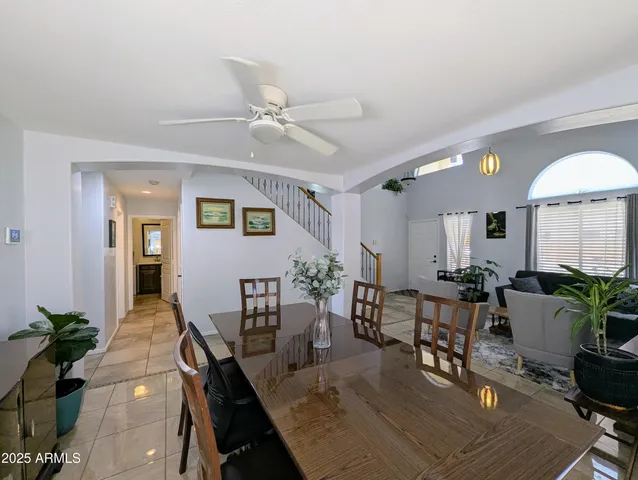 a view of a dining room with furniture and window