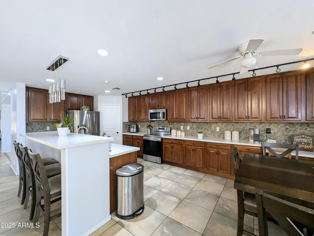 a living room with furniture gym equipment and a flat screen tv
