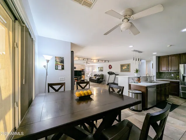 a view of a livingroom with furniture and staircase