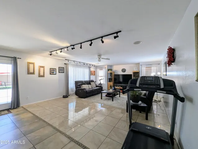 a view of a livingroom with furniture and window