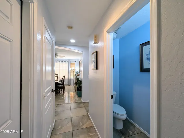 a living room with fireplace furniture and a book shelf