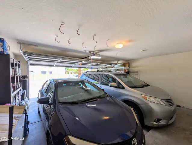 a en suite bathroom with a double vanity sink and a mirror