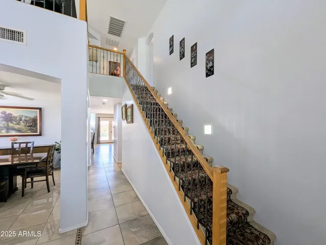 a bathroom with a double vanity sink toilet and shower