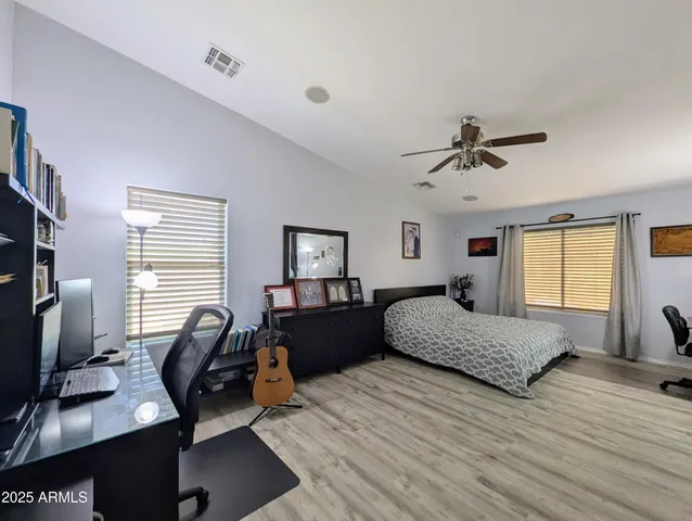a view of a workspace with furniture and closet