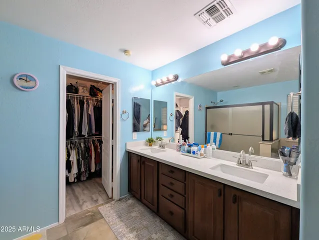 a view of a workspace with furniture and wooden floor