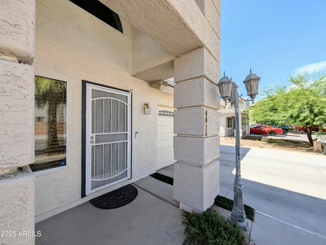 a living room with furniture ceiling fan and a window