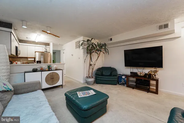 a kitchen with stainless steel appliances a sink stove and refrigerator