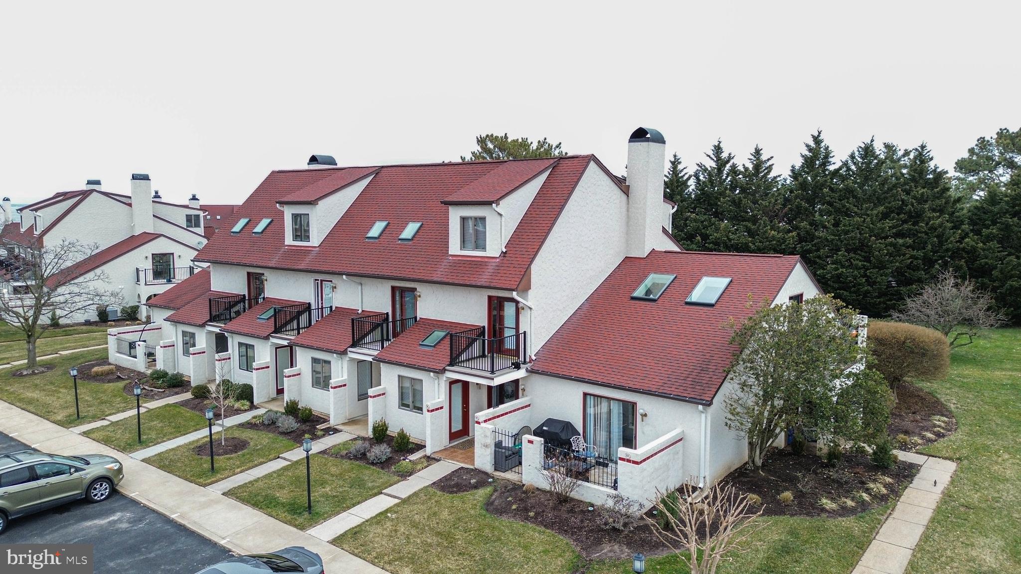 8 Queen Victoria Way Chester, MD 21619 - Photo 2 of 30 a front view of a house with a yard and garage