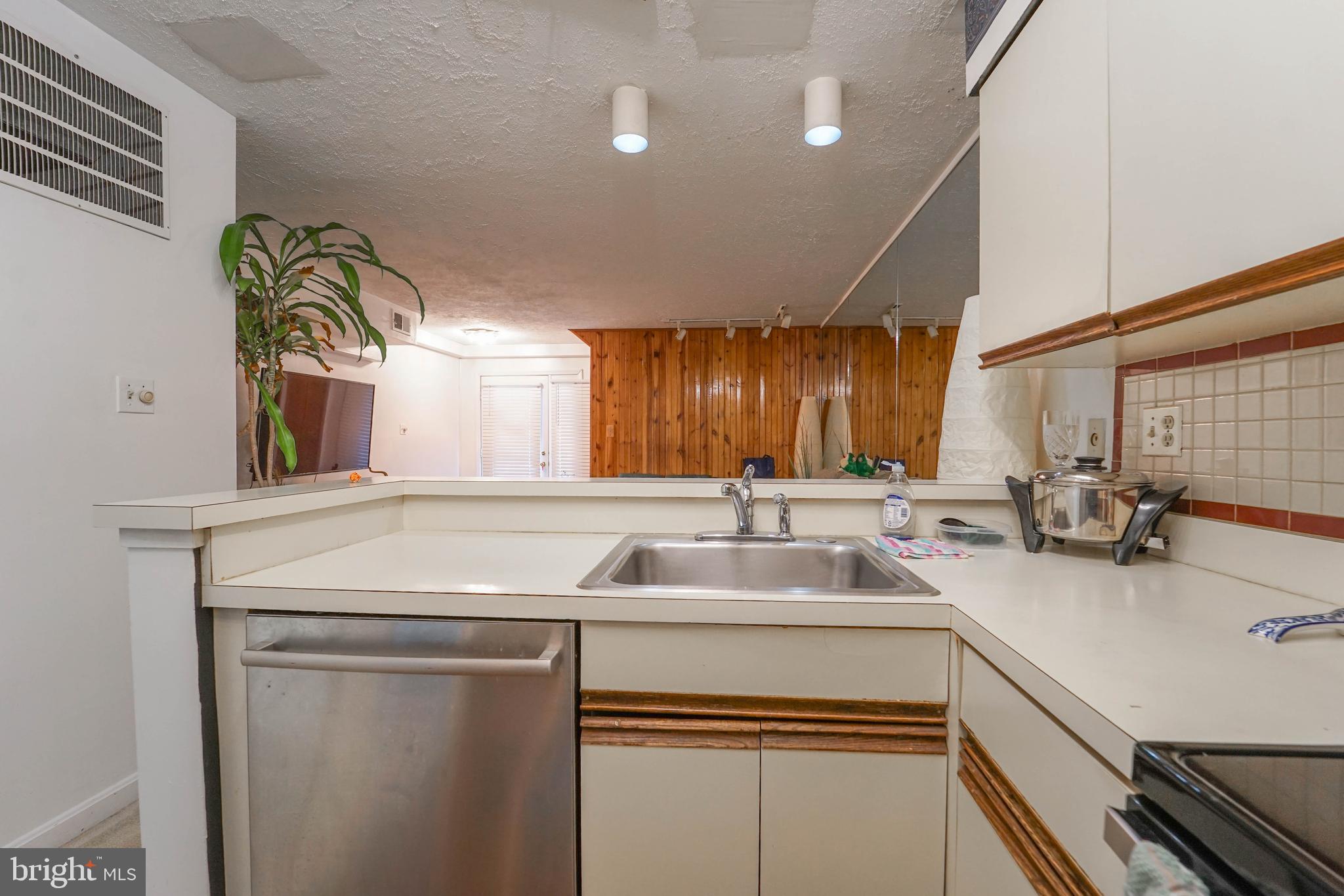8 Queen Victoria Way Chester, MD 21619 - Photo 23 of 30 a kitchen with a sink cabinets and window