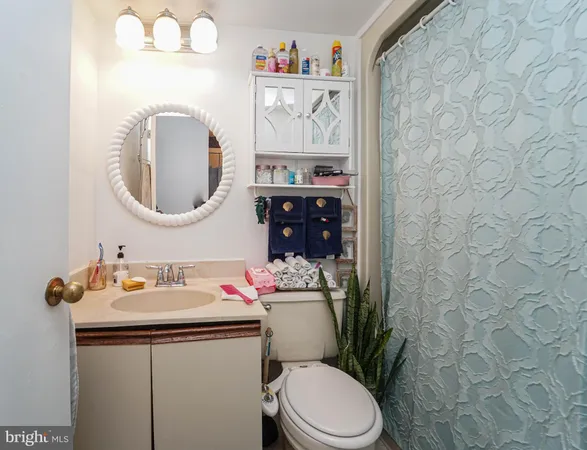 a bedroom with a large bed and a large mirror