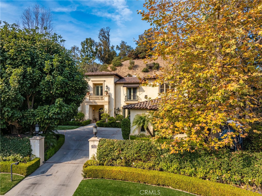 12094 Summit Circle Beverly Hills, CA 90210 - Photo 2 of 23 a front view of a house with garden