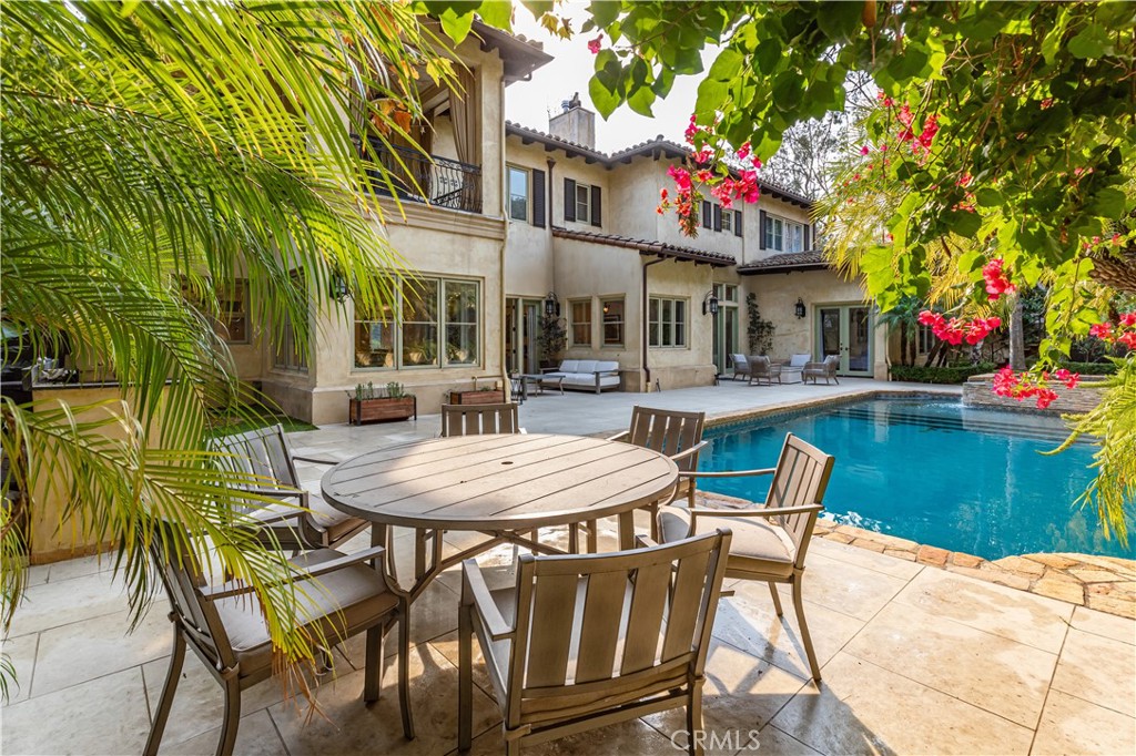 12094 Summit Circle Beverly Hills, CA 90210 - Photo 21 of 23 a view of a chairs and table in a patio