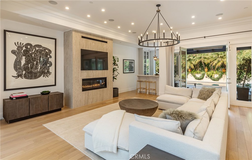 12094 Summit Circle Beverly Hills, CA 90210 - Photo 5 of 23 a living room with furniture a flat screen tv and a large window