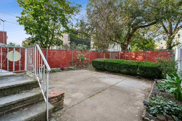 a view of backyard with green space