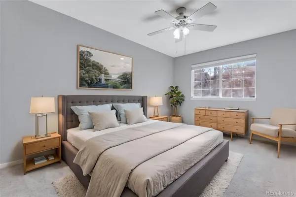 a bedroom with a bed and a couch