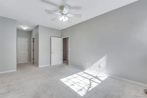a view of an empty room with windows