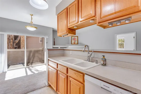 a kitchen with stainless steel appliances granite countertop a sink and a cabinets