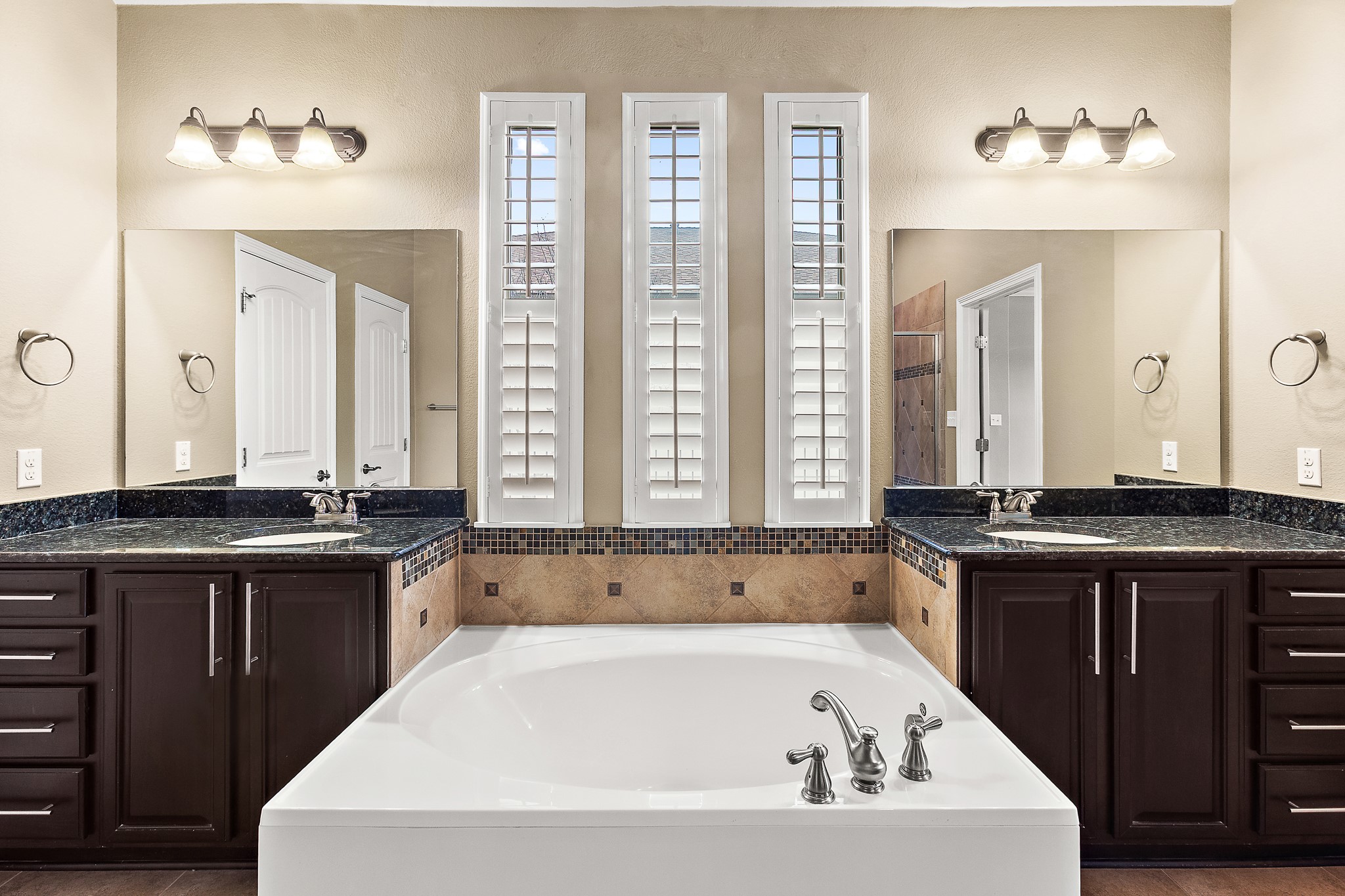 224 Tavish Trail Austin, TX 78738 - Photo 19 of 40 a large white bathroom with a large tub sink and vanity