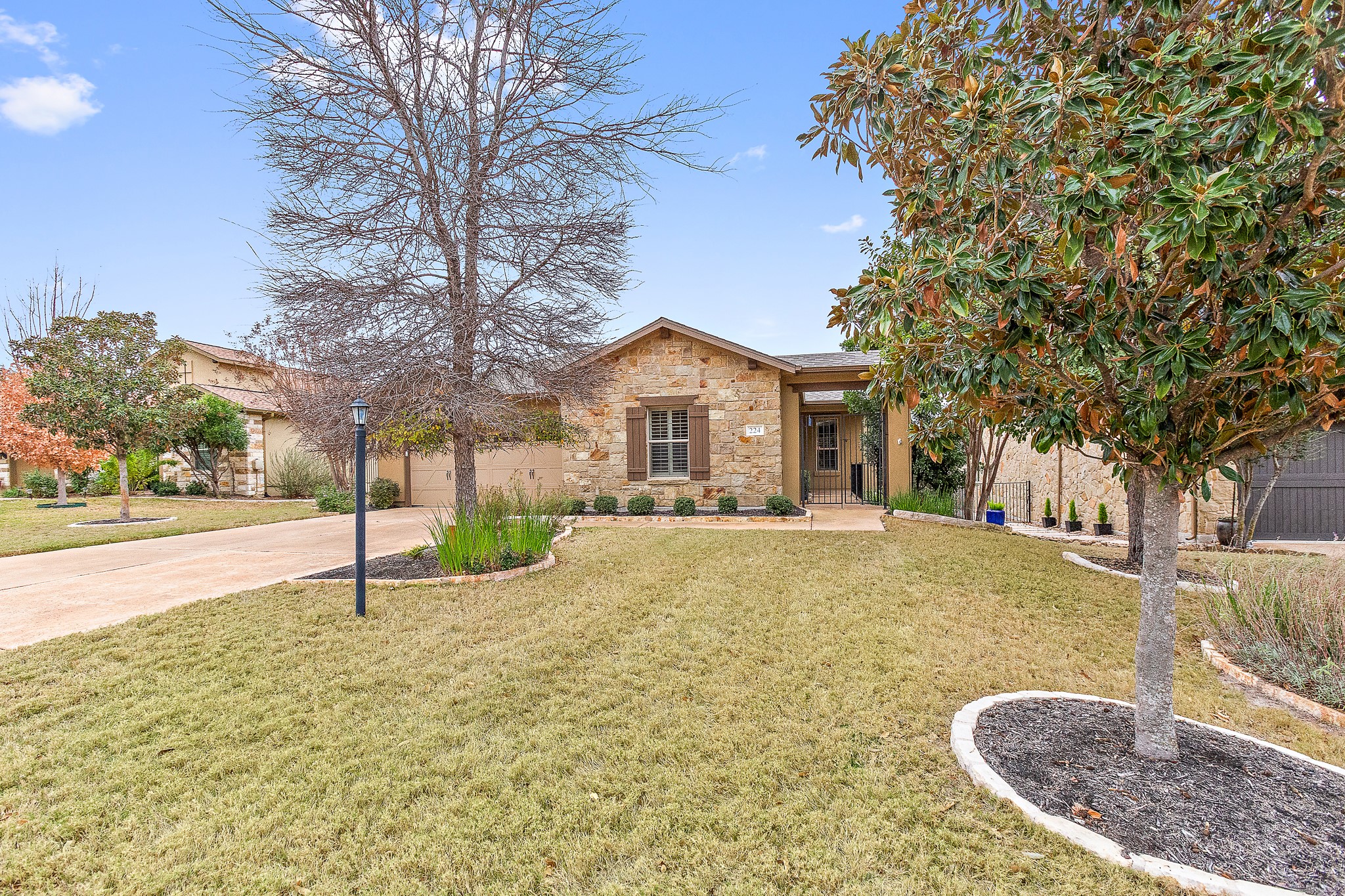 224 Tavish Trail Austin, TX 78738 - Photo 2 of 40 a house with trees in the background